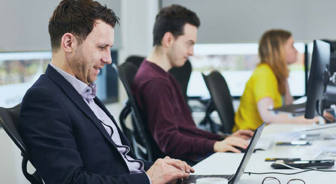 Office workers using BigChanges JobWatch platform